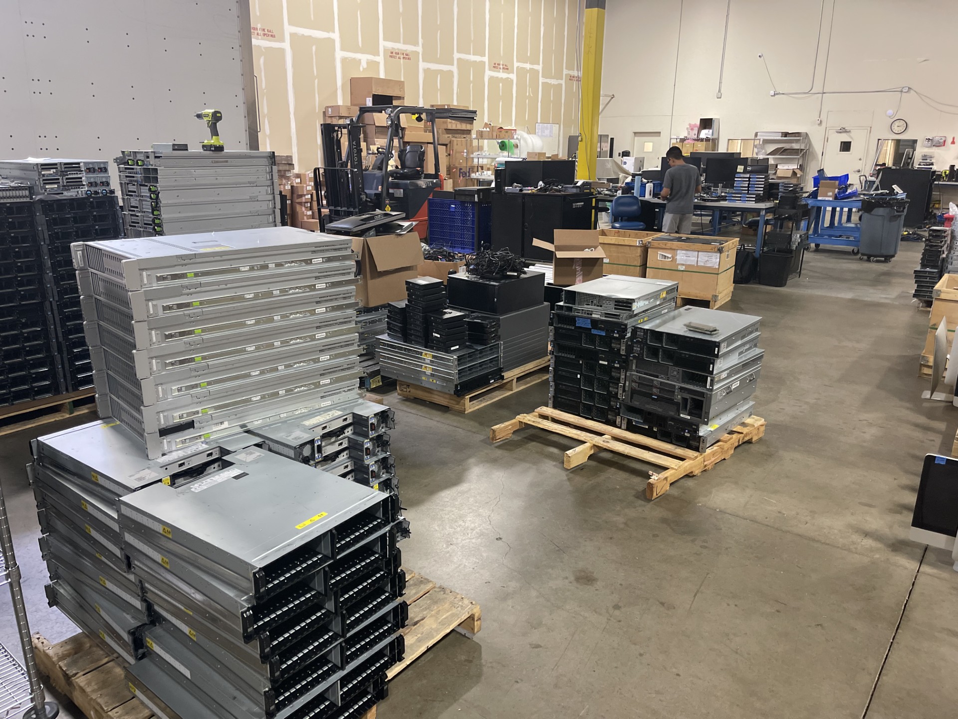 Our Marietta, GA processing facility — intake tables, equipment shelving, and processing stations